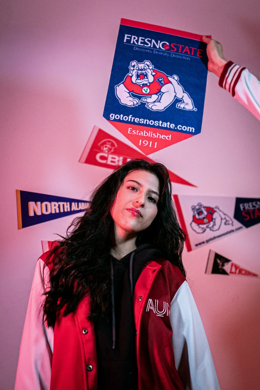 AUP student with a Fresno State pennant