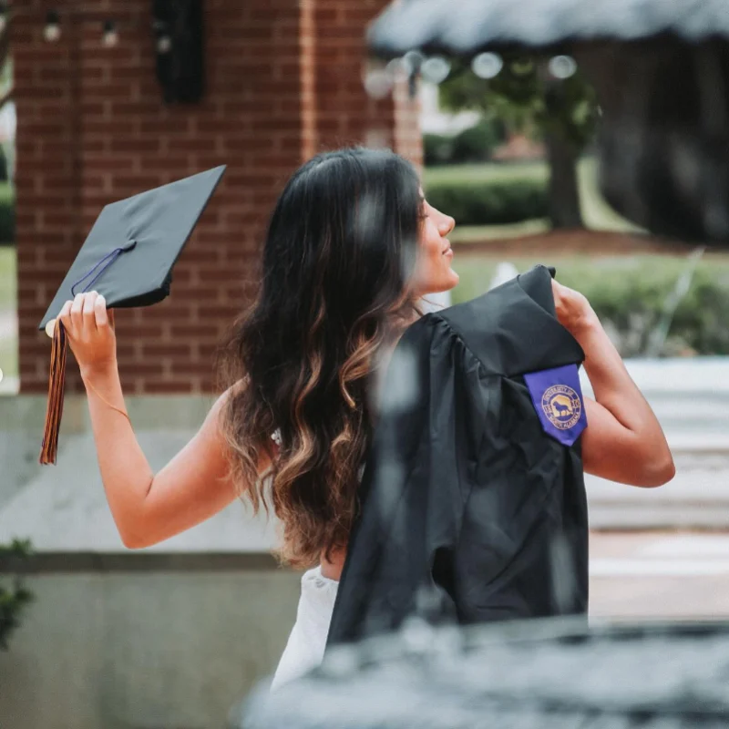 Seilin Pozo with her cap and gown at graduation