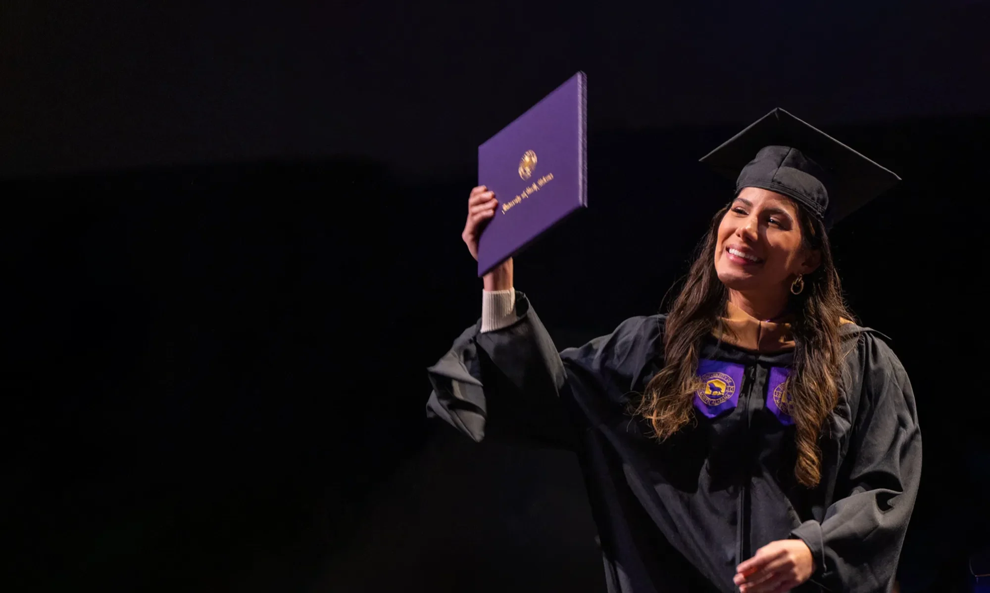 AUP graduates celebrating at their graduation ceremony